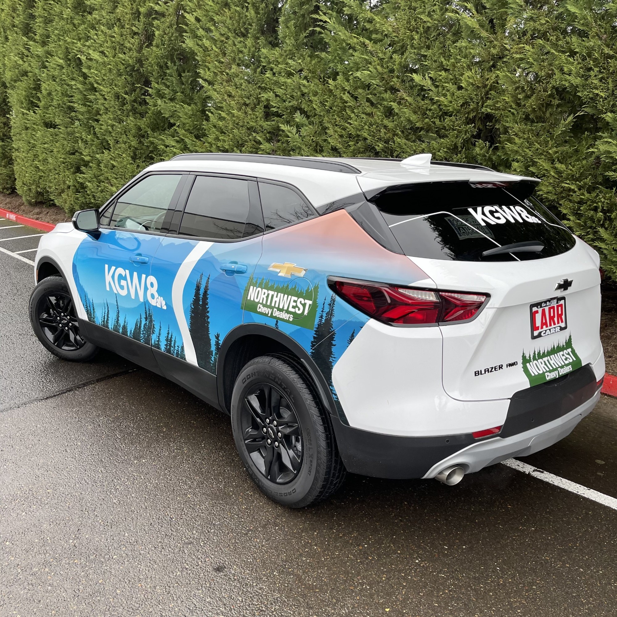 KGW 8 Chevrolet Blazer with blue forest graphics, rear three-quarter view