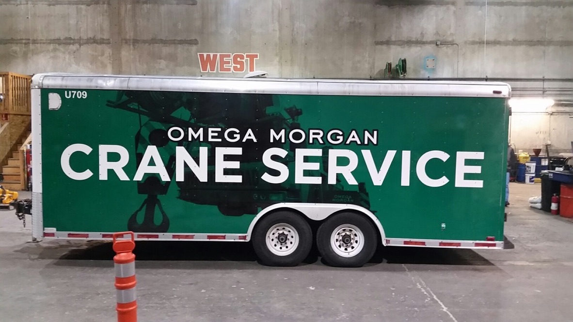 Omega Morgan crane service trailer graphics